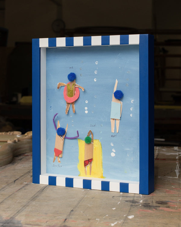 Family Swimming Scene in a Striped Blue Frame