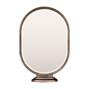 A mockup of a pill-shaped mirror with a bronze frame. The mirror is supported by a tiered base so it can be secured to a  flat surface. 