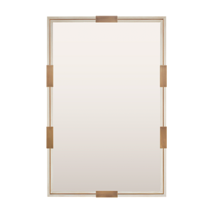 A bespoke mirror finished in distressed white with an antique brass inlay and clips. 