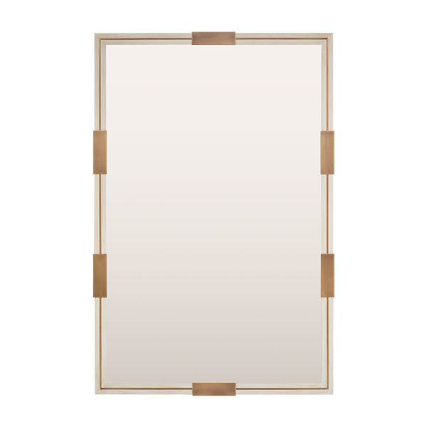 A bespoke mirror finished in distressed white with an antique brass inlay and clips. 