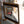 The back of a large rectangular TV mirror made using dielectric mirror glass, which is transparent. 